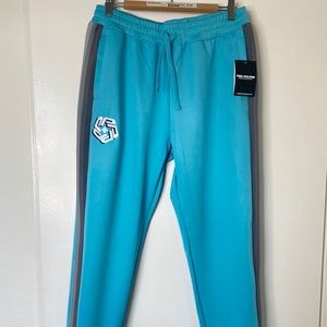 NWT PINK DOLPHIN SPLASH COACHES BLUE TRACK PANTS